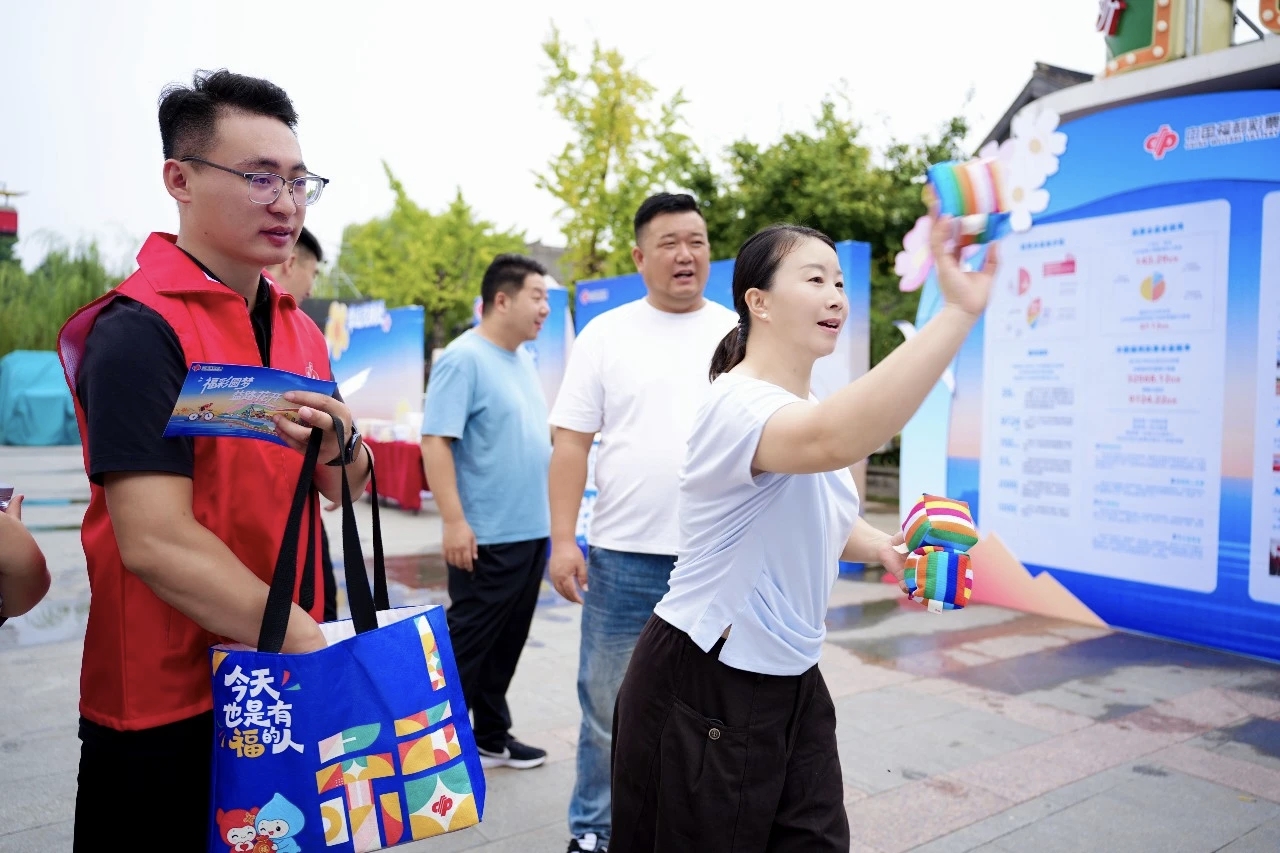 福彩圆梦 益路花开——山东imToken钱包下载福彩公益宣传活动走进台儿庄古城