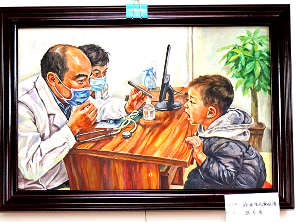 入展油画再现医疗帮扶里的粤桂情。盘京摄